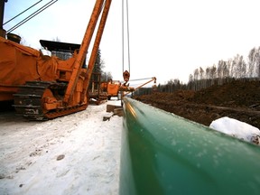 Inter Pipeline Fund laying its Polaris condensate pipeline in Alberta in 2011, image courtesy the company. The federal government released its overhaul to regulatory review of major resource development projects in a massive budget bill on Thursday.