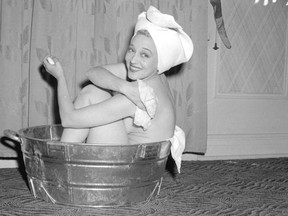 Miss Sally Rand bathing in a washtub in September, 1943  - City of Vancouver Archives CVA 1184-119