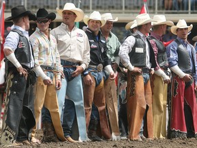 Cowboys line up for the open ceremonies for the 2008 edition of the Calgary Stampede. 
Photo: Herald archives