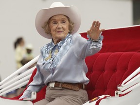 Patsy Rodgers waves to the crowd during the Calgary Stampede Parade in 2008. Photo by Stuart Gradon, Calgary Herald