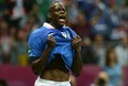 Italian forward Mario Balotelli reacts after scoring during the Euro 2012 football championships semi-final match Germany vs Italy on June 28, 2012 at the National Stadium in Warsaw.     AFP PHOTO/ PATRIK STOLLARZPATRIK STOLLARZ/AFP/GettyImages