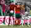 Portuguese forward Cristiano Ronaldo (L) takes a free kick during the Euro 2012 football championships semi-final match Portugal vs Spain on June 27, 2012 at the Donbass Arena in Donetsk. PATRICK HERTZOG/AFP/GettyImages