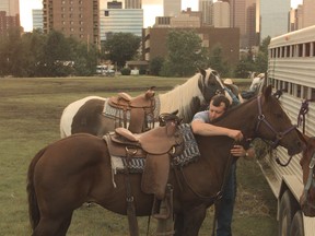 In 1998 Keith Anderson gets his horse ready for a ride at Tent City, situated just behind Fort Calgary near the Bow River. 
Photo: Herald archive