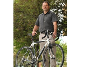 Jeff Quigley, municipal lands specialist with Rocky View County, with his bike in Calgary. Quigley has proposed a trail system along Highway 8 from Bragg Creek to Calgary. Stuart Gradon, Calgary Herald