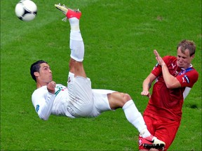 Portuguese forward Cristiano Ronaldo (L) tries to score despite Czech defender David Limbersky during the Euro 2012 football championships quarter-final match between the Czech Republic and Portugal on June 21, 2012 at the National Stadium in Warsaw. AFP PHOTO / GABRIEL BOUYSGABRIEL BOUYS/AFP/GettyImages