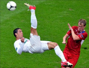 Portuguese forward Cristiano Ronaldo (L) tries to score despite Czech defender David Limbersky during the Euro 2012 football championships quarter-final match between the Czech Republic and Portugal on June 21, 2012 at the National Stadium in Warsaw. AFP PHOTO / GABRIEL BOUYSGABRIEL BOUYS/AFP/GettyImages