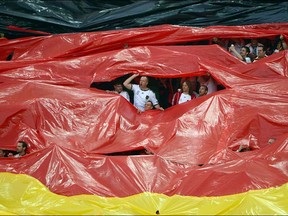 Fans of Germany's national football team display a giant flag ahead of the Euro 2012 football championships quarter-final match Germany vs Greece on June 22, 2012 at the Gdansk Arena.    ANNE-CHRISTINE POUJOULAT/AFP/GettyImages