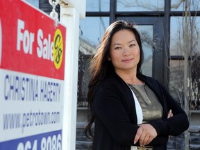 Calgary realtor Christina Hagerty outside one of her listed properties earlier this year.