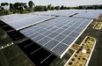 Solar panels sit above the a parking lot in San Diego, California. Such changes can make parking lots more useful and productive. Sandy Huffaker, Getty Images.