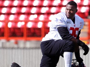 Defensive end Charleston Hughes takes a break during Thursday's training camp practice at McMahon Stadium. Photo, Leah Hennel, Calgary Herald.