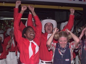 Calgary Stampede Showband members celebrate their winning of the World Championship of Marching Show Bands. L to R: Lora Lee Lawson, Trevor Lyons and Tara Scarlett scream as they realized they had won the championship. 
Photo: Herald archive