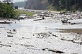 Parks Canada spokesman Mark Merchant says that earlier Saturday morning, crews were able to reopen both eastbound and westbound lanes of the Trans-Canada Highway.