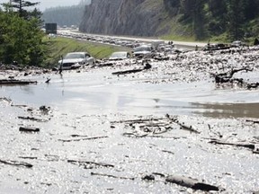 Parks Canada spokesman Mark Merchant says that earlier Saturday morning, crews were able to reopen both eastbound and westbound lanes of the Trans-Canada Highway.