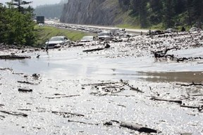 Parks Canada spokesman Mark Merchant says that earlier Saturday morning, crews were able to reopen both eastbound and westbound lanes of the Trans-Canada Highway.