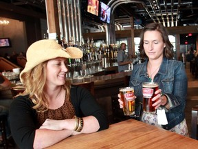 Marketing manager Alison Robertson brings over a round for herself and event co-ordinator Jana Thompson at the CRAFT Beer Market.