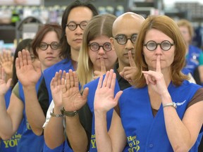 Muted muggles: Toronto Wal-Mart associates pledge not to reveal the ending to the last installment of the Harry Potter series, Harry Potter and the Deathly Hallows.  Herald file photo.