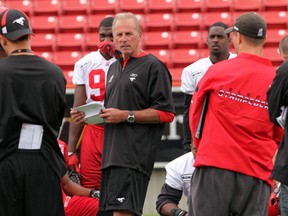 Stamps coach and GM John Hufnagel speaks to his team at the end of Monday's practice at McMahon Stadium. Photo, Lorraine Hjalte, Calgary Herald