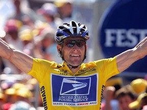 Lance Armstrong celebrates winning a stage in the 2004 Tour de France.