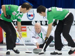 Sweepers Brent Laing, left, and Craig Savill brush a stone thrown by skip Glenn Howard during a 2011 Grand Slam event in Oshawa. Photo, Anil Mungal/Capital One