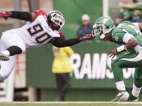 For the record, this is not allowed in the CFL. Stamps defensive end Chris McCoy facemasks Riders QB Darian Durant during the Stamps' win on Saturday. Photo, Liam Richards, Canadian Press