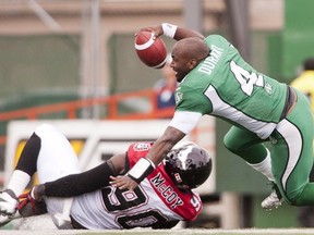 Stamps defensive end Chris McCoy holds evidence of the play that earned him a facemasking penalty on Saturday in Regina, and also apparently ended his season with a torn knee ligament. Photo, Liam Richards, The Canadian Press.