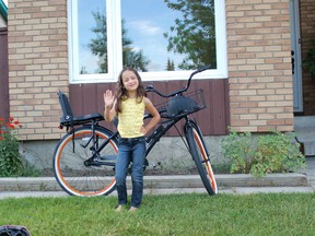 My daughter and our miraculously recovered stolen bike.