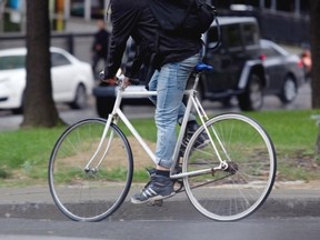 A bicycle courier rides a single speed bike with no brake, known as a fixie. It is the type of bike that Tyrell Sterling was riding last week when he was run over and killed by a truck in Lachine. Allen McInnis, Postmedia News