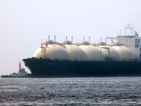 Adabi, Brunei's 111,461 tone and 290-meter long liquefied natural gas (LNG) tanker, leaves a berth in Yokohama, south of Tokyo,Photographer: Kimimasa Mayama/Bloomberg News