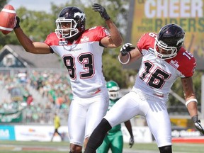 Stamps receiver Romby Bryant, left, celebrates a touchdown with teammate Marquay McDaniel during the Stamps' last visit to Regina, on Aug. 25.
