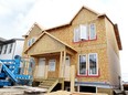 With the help of over 50,000 volunteers every year, Habitat for Humanity Canada builds affordable housing and promotes home ownership as a means to break the cycle of poverty. Photo: Christina Ryan, Calgary Herald.