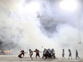 It was a surreal scene of smoke and falling snow as Calgary Stampeders kicker Rene Paredes booted a second quarter convert against the Hamilton Ti-Cats Saturday night October 2012. Calgary won 34-32.