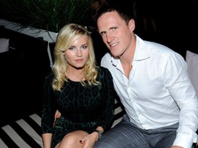 Power-couple Elisha Cuthbert and Dion Phaneuf try to figure out where they are while staring at pretty, flashing lights.