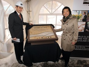 Chris Bourassa, chief operating officer of 26th Avenue River Investment Inc., and Ald. John Mar at the unveiling of a cornerstone at The River project