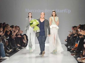 Designer Duy Nguyen wins the Mercedes Benz Start Up National Final at Toronto Fashion Week in Toronto. Photo: The Canadian Press.