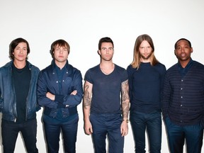 That guy who sings in Maroon 5, centre, with the other guys who are in Maroon 5.