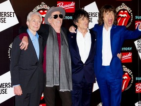 From left, Charlie Watts, Keith Richards, Ronnie Wood and Mick Jagger, from the British Rock band The Rolling Stones, arrive at a central London venue, to mark the 50th anniversary of the Rolling Stones first performance, Thursday, July 12, 2012. (AP Photo/Jonathan Short)