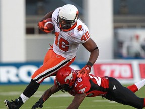 Stamps defensive back Brandon Smith makes an open-field tackle on Lions fullback Rolly Lumbala during a game earlier this season. Photo, Ted Rhodes, Calgary Herald