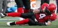 Stamps quarterback Drew Tate lays on the ground after taking the helmet-to-helmet hit from Riders defensive lineman Tearrius George on Sunday. Photo, Lorraine Hjalte, Calgary Herald