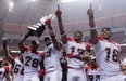 Stampeder players celebrate after winning the West Division title on Sunday in Vancouver. Photo, Ward Perrin, PNG