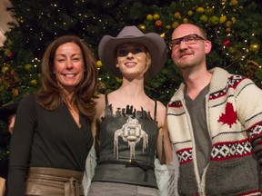 Gisele Danis of Tourism Calgary and designer Paul Hardy pose with a model wearing Hardy's tweet dress, which was revealed at The Core's 'Twas the Night event. Photos: Neil Zeller, Tourism Calgary.