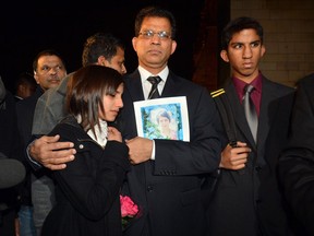 Husband of the late nurse Jacintha Saldanha, Benedict Barboza arrives at the Houses of Parliament in central London with daughter Lisha, 14, and son Junal, 16, for a meeting with a British Member of Parliament about Jacintha Saldanha's death on Monday Dec, 10, 2012.
