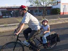 Tom Thivener, the City of Calgary's first bicycle co-ordinator, with his daughter. Courtesy, TucsonVelo.com