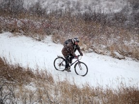 Benjamin Sherwin bikes through the snowstorm on his way to work in Calgary, Alberta earlier this year. Leah Hennel, Calgary Herald