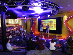 Teens rule in Vibe, a club created exclusively for guests ages 14 to 17 aboard the Disney Dream. A media room serves as the central gathering space in this trendy and casual crash pad, with video gaming and movie watching on a giant LCD screen with digital surround sound. (Diana Zalucky, photographer)