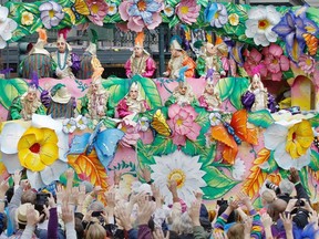 Mardi Gras 2013: Revelers plead with outstretched arms for throws (beads and small gifts) from riders in the Rex Parade in Canal Street on Mardi Gras Day. Fat Tuesday, the traditional celebration on the day before Ash Wednesday and the beginning of Lent, is marked in New Orleans with parades and marches through many neighborhoods in the city. Calgary Herald wire services.