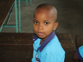 This student -- along with other blue-shirted classmates in photos on this page -- attends a school where teachers have graduated from a program at the Aga Khan University's Institute for Educational Development, East Africa. Photos by Monica Zurowski.