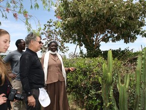 Jane Marindany (far right) shows Awali visitors the vegetables and fruits she now grows on her property; she plans on selling them to make money to continue improving her family's financial situation. Also pictured are Canadian visitor Josie Shields, Santai Kimakeke (associate director of Kenyan programs for Me to We), and Awali co-founder Brian Felesky.
Photos by Monica Zurowski.