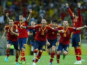 Sergio Ramos of Spain and his team-mates celebrate after Jesus Navas scored the winning penalty in a shootout during the FIFA Confederations Cup Brazil 2013 Semi Final match between Spain and Italy at Castelao on June 27, 2013 in Fortaleza, Brazil.  (Photo by Robert Cianflone/Getty Images)