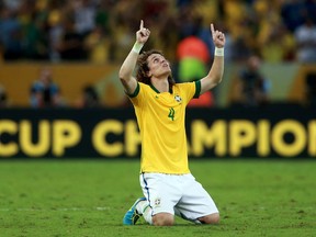 David Luiz of Brazil celebrates at the end of the FIFA Confederations Cup Brazil 2013 Final match between Brazil and Spain at Maracana on June 30, 2013 in Rio de Janeiro, Brazil.  (Photo by Scott Heavey/Getty Images)