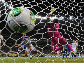 Italy's midfielder Daniele De Rossi (L in blue, partially covered) heads the ball to score past Japan's goalkeeper Eiji Kawashima during their FIFA Confederations Cup Brazil 2013 Group A football match, at the Pernambuco Arena in Recife, on June 19, 2013. YASUYOSHI CHIBA/AFP/Getty Images